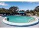 Refreshing community pool with ample lounge chairs and shade umbrellas at 315 30Th W Ave # B210, Bradenton, FL 34205