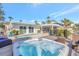 A luxurious backyard showcasing a pool, hot tub, and outdoor pergola for relaxation at 320 Avenida Leona, Sarasota, FL 34242