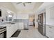 Contemporary kitchen with white cabinets, stainless steel appliances, and sleek countertops at 320 Avenida Leona, Sarasota, FL 34242