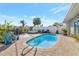 Beautiful backyard pool featuring a dolphin water feature, lounge chairs, and a relaxing hot tub at 320 Avenida Leona, Sarasota, FL 34242