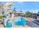 An inviting pool with a dolphin statue and water feature, creating a serene outdoor oasis at 320 Avenida Leona, Sarasota, FL 34242