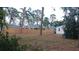 View of the backyard, showing a wooden fence separating it from a neighboring property at 3218 Avenue A W, Bradenton, FL 34205