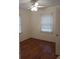 Bright bedroom with hardwood floors and ceiling fan at 3218 Avenue A W, Bradenton, FL 34205