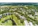 Aerial view showing condo community near golf course and water at 3620 Ironwood Cir # 405, Bradenton, FL 34209