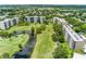 Aerial view of condo community with golf course and water features at 3620 Ironwood Cir # 405, Bradenton, FL 34209