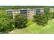 Aerial view of condo building beside green space at 3620 Ironwood Cir # 405, Bradenton, FL 34209