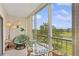 Relaxing balcony space with wicker furniture and tranquil golf course views at 3620 Ironwood Cir # 405, Bradenton, FL 34209