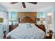 Bright bedroom featuring a king-size bed and coastal decor at 3620 Ironwood Cir # 405, Bradenton, FL 34209