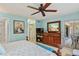 Main bedroom with large bed, dresser, and access to private balcony at 3620 Ironwood Cir # 405, Bradenton, FL 34209