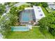 Enclosed community pool with surrounding deck and shuffleboard at 3620 Ironwood Cir # 405, Bradenton, FL 34209