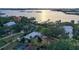 Aerial view of waterfront home with pool and dock at 3950 Red Rock Way, Sarasota, FL 34231