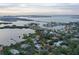 Aerial view of house and surrounding waterfront community at 3950 Red Rock Way, Sarasota, FL 34231