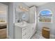 Elegant bathroom with a double vanity and large mirror at 4250 Players Pl # 2622, Sarasota, FL 34238