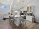 Modern kitchen with white cabinets, granite countertops and island at 4250 Players Pl # 2622, Sarasota, FL 34238