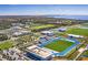 Aerial view of campus showing athletic fields, stadium and surrounding landscape at 4503 Coral Lake Dr, Bradenton, FL 34210