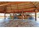 Beach bar with colorful stools and a thatched roof at 4503 Coral Lake Dr, Bradenton, FL 34210