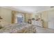 Bedroom with white dresser and floral bedding at 4503 Coral Lake Dr, Bradenton, FL 34210