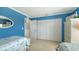 Guest bedroom with twin beds and built-in closet at 4503 Coral Lake Dr, Bradenton, FL 34210