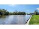 Serene canal view with a wooden dock at 4503 Coral Lake Dr, Bradenton, FL 34210