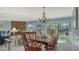 Bright dining area with water views and stone fireplace at 4503 Coral Lake Dr, Bradenton, FL 34210