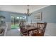 Bright dining room with water views and wood table and chairs at 4503 Coral Lake Dr, Bradenton, FL 34210