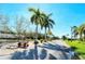 Community entrance with palm trees and signage at 4503 Coral Lake Dr, Bradenton, FL 34210