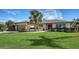 Single-story home with a landscaped lawn, attached garage, and attractive curb appeal at 4503 Coral Lake Dr, Bradenton, FL 34210
