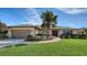 One-story house with a well-maintained lawn and attractive landscaping at 4503 Coral Lake Dr, Bradenton, FL 34210