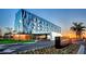 Modern hotel exterior at sunset with landscaping at 4503 Coral Lake Dr, Bradenton, FL 34210