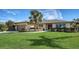 House exterior with manicured lawn and driveway at 4503 Coral Lake Dr, Bradenton, FL 34210