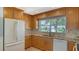 Bright kitchen with granite countertops and wood cabinets at 4503 Coral Lake Dr, Bradenton, FL 34210