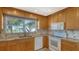 Well-equipped kitchen with granite countertops and wood cabinets at 4503 Coral Lake Dr, Bradenton, FL 34210