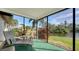 Spacious screened porch with wicker furniture at 4503 Coral Lake Dr, Bradenton, FL 34210