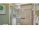 Walk-in shower with grab bars and tiled walls at 4503 Coral Lake Dr, Bradenton, FL 34210