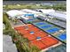 Aerial view of tennis courts and a tennis facility at 4503 Coral Lake Dr, Bradenton, FL 34210