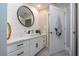 Modern bathroom with white cabinets, quartz countertops, and a sleek sink at 4517 N Lake Dr, Sarasota, FL 34232