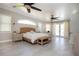 Bright bedroom with king-size bed and access to backyard at 4517 N Lake Dr, Sarasota, FL 34232