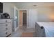 Bedroom with a queen-size bed and access to another room at 4517 N Lake Dr, Sarasota, FL 34232