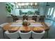 Stylish dining room with a unique wooden table and chandelier at 4517 N Lake Dr, Sarasota, FL 34232