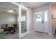 Entryway with barn door and view into living room at 4517 N Lake Dr, Sarasota, FL 34232