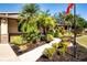 Landscaped front yard with walkway and palm trees at 4517 N Lake Dr, Sarasota, FL 34232