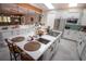 Updated kitchen featuring white cabinets, quartz countertops, and island at 4517 N Lake Dr, Sarasota, FL 34232