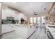 Spacious kitchen with white cabinets, large island, and stainless steel appliances at 4517 N Lake Dr, Sarasota, FL 34232