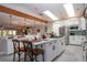 Modern kitchen with white cabinets, a large island, and skylights at 4517 N Lake Dr, Sarasota, FL 34232