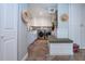 Clean laundry room with storage, bench, and stylish finishes at 4517 N Lake Dr, Sarasota, FL 34232