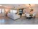 Open concept living area with white furniture and modern light fixtures at 4517 N Lake Dr, Sarasota, FL 34232