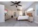 Large main bedroom with a king-size bed, ceiling fans and plenty of natural light at 4517 N Lake Dr, Sarasota, FL 34232