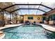 Large screened pool with plenty of seating and a spa at 4517 N Lake Dr, Sarasota, FL 34232