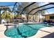 Relaxing pool and spa with screened enclosure and outdoor seating at 4517 N Lake Dr, Sarasota, FL 34232