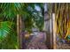 Brick pathway leads through a lush garden with bamboo at 4563 Trails Dr, Sarasota, FL 34232